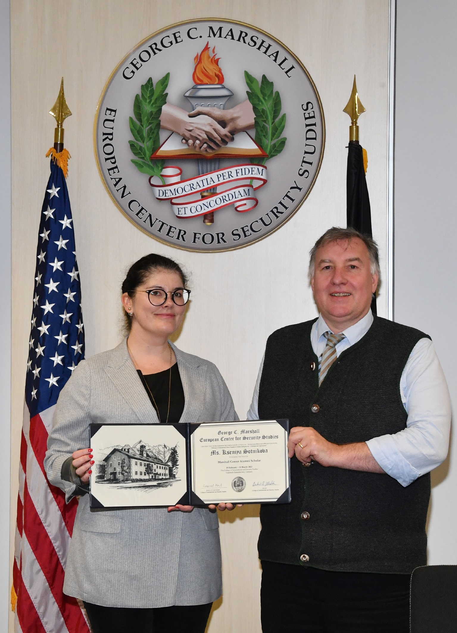 Kseniya Sotnikova receives certificate from Marshall Center Professor Dr. Graeme Herd