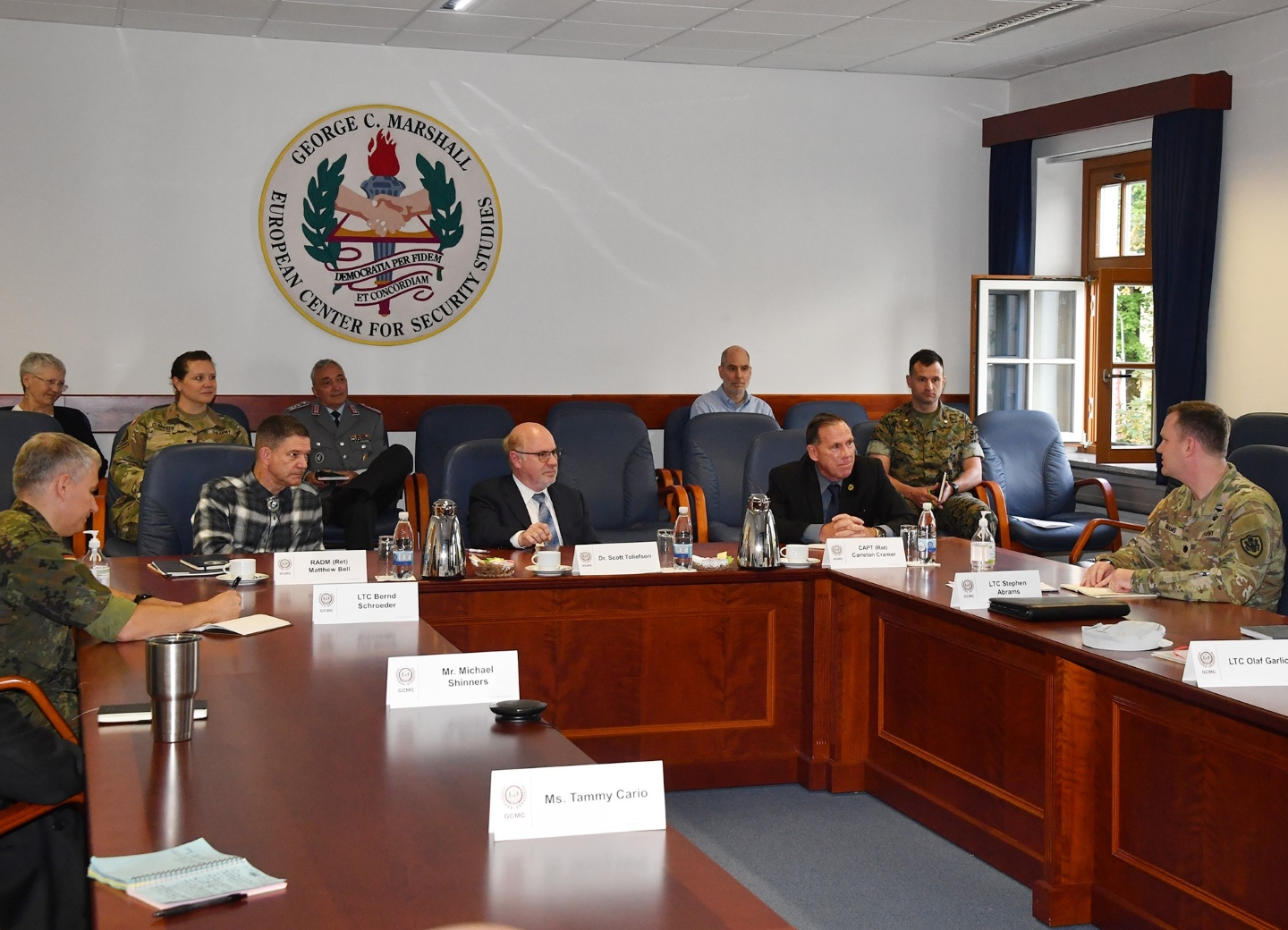 The deans listen in during a briefing of the Marshall Center