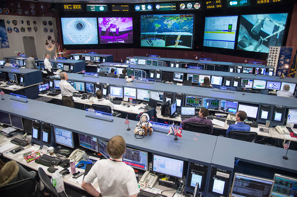 JSC2014-E-005996 (12 Jan. 2014) --- As the Canadarm2 berthed the Orbital Sciences Corp. Cygnus commercial cargo craft to the Harmony node of the International Space Station on Jan. 12, 2014, flight controllers supported the orbital work in the space station flight control room (FCR-1) in JSC's Mission Control Center. Photo credit: NASA