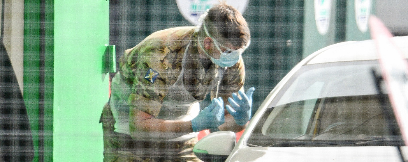 Masked military asking questions at car park
