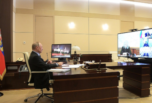 Photo of President Putin in a video confrence for COVID-19.