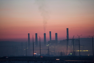 This photograph taken on January 29, 2018, shows smoke rising from chimneys of the Kosovo power plant near the town of Obiliq on the outskirts of Pristina. Every winter morning workers wrap scarves around their faces and emerge from the pea soup fog that engulfs their town of Obiliq, stuck between two coal-fired power stations on the outskirts of Kosovo's capital. 