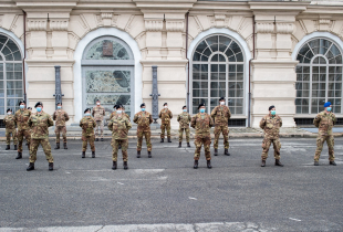 A line up of Italian army nurses wearing a protective mask during the presentation of the army team who will participate in the Piedmont hospitals in the fight against the virus, in Turin, Italy, on April 27, 2020. 