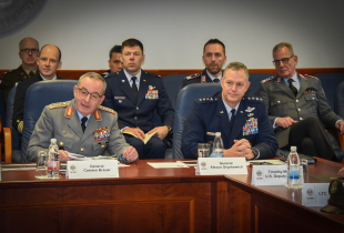 German Chief of Defence Gen. Carsten Breuer and U.S. Air Force Gen. Alexus Grynkewich sit at a conference table during a roundtable discussion at the Marshall Center, joined by senior military officers from Germany and the United States seated behind them.