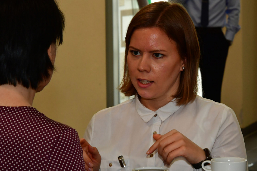 A photograph of participants in the SRS course 19-04 attending a reception.
