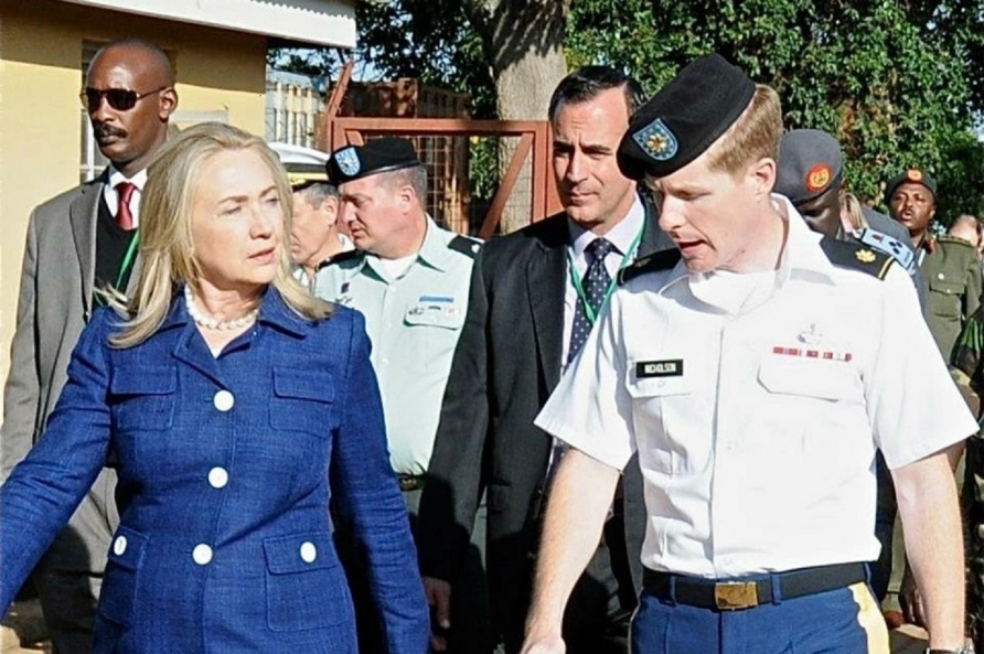 MAJ Brad Nicholson briefs Secretary Clinton on the status of the Ugandan Armed Forces. 