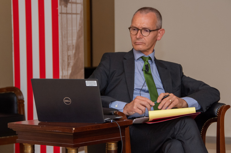 Ralf Roloff looks at his computer while moderating the Loisach Group panel discussion.