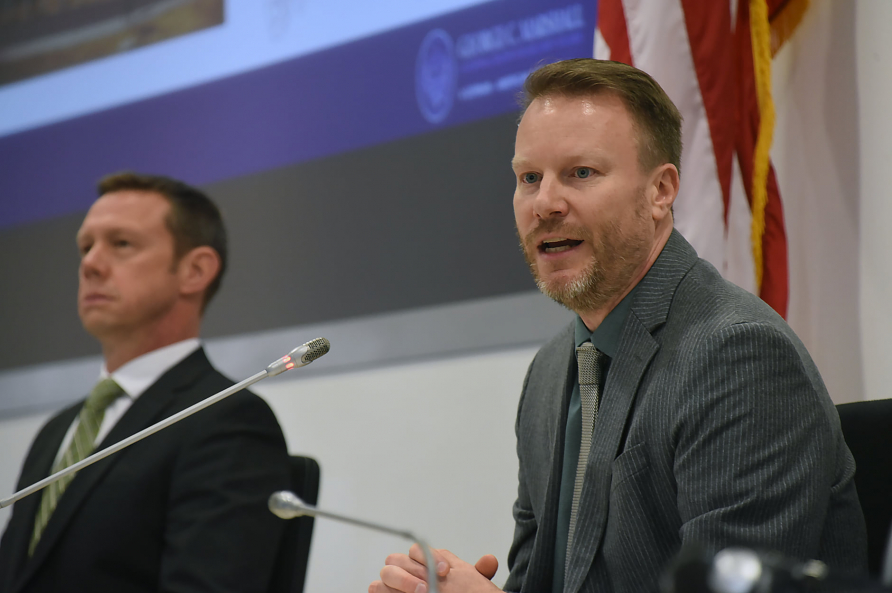 A photograph of Professor Nickels and Col. Sousa speaking at an GARSS event.