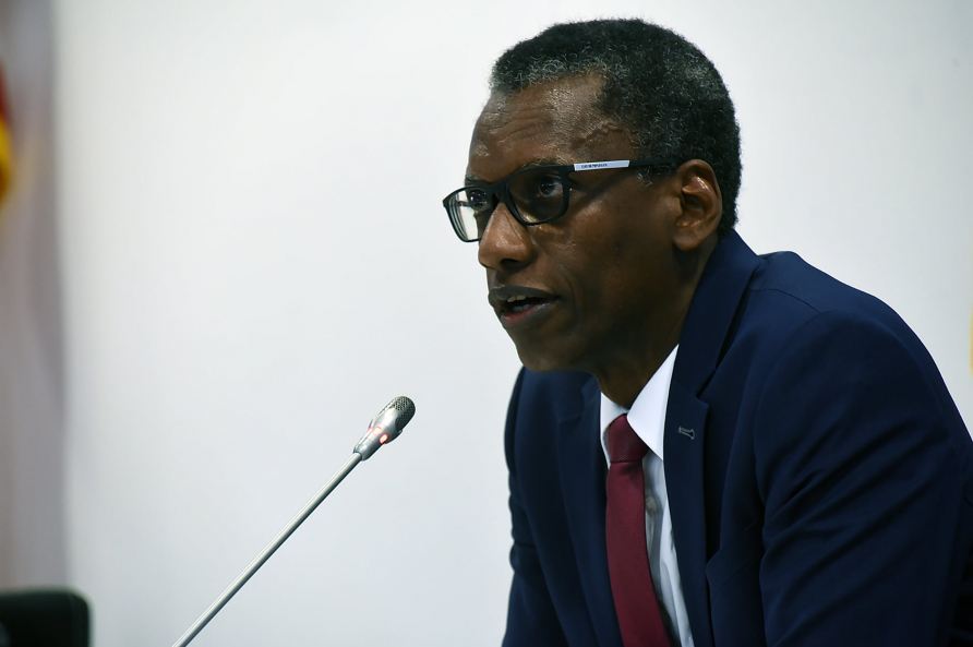 A photograph of Lieutenant Colonel Dr. habil. Youssouf speaking at a GARSS event.