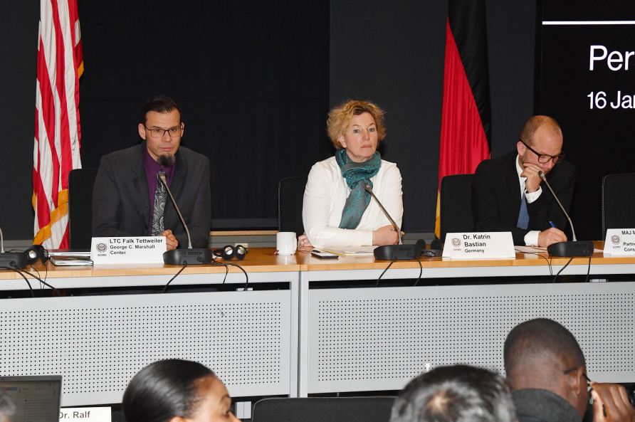 Marshall Center's Lt. Col. Falk Tettweiler, Dr. Katrin Bastian and Maj. Martin Schuster speak during Research Week