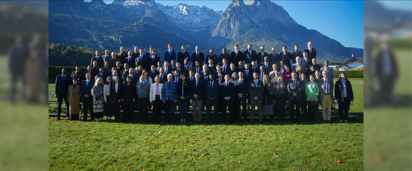 PASS 2025 participants outside at the Marshall Center with the Bavarian Alps in the background.